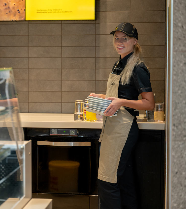 What can McDonald's clean in a hooded dishwasher, and a dish and warewasher?